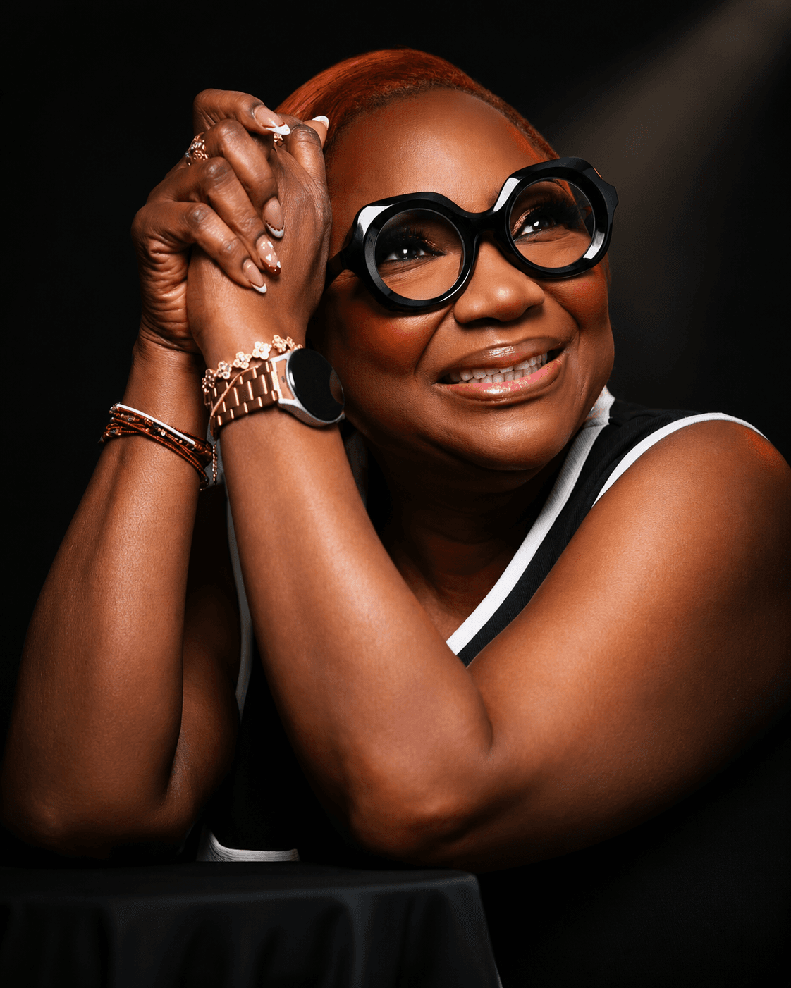 Pastor Tinu Asegieme, hands clasped, portrait