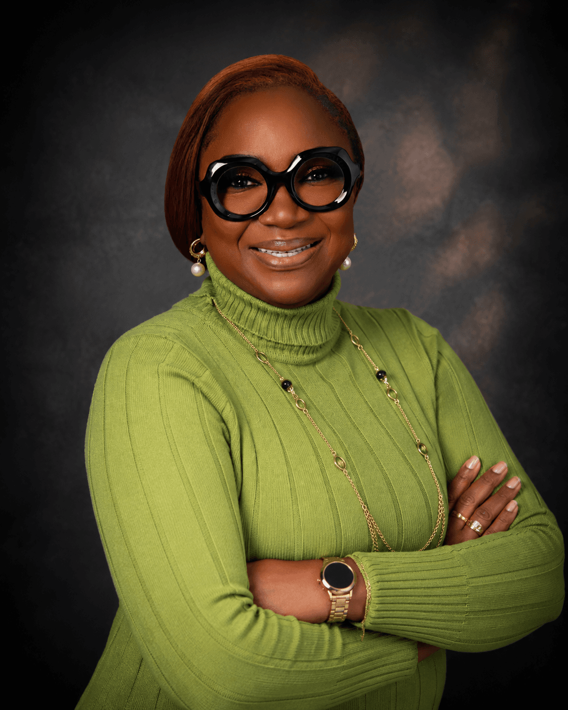 Pastor Tinu Asegieme, arms crossed, confident portrait